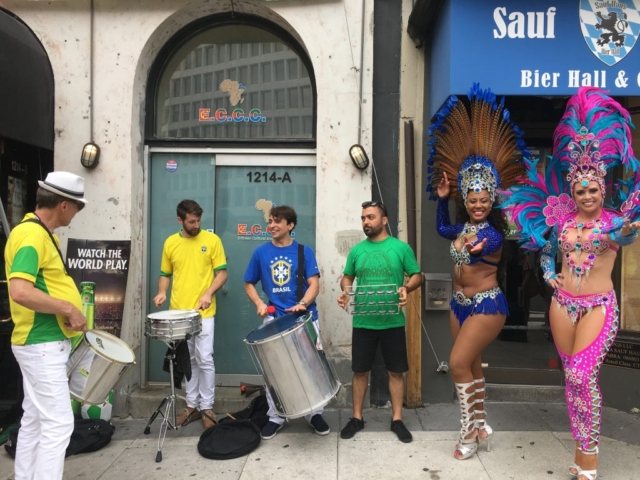 Dancing and drumming outside of Public Bar before the game